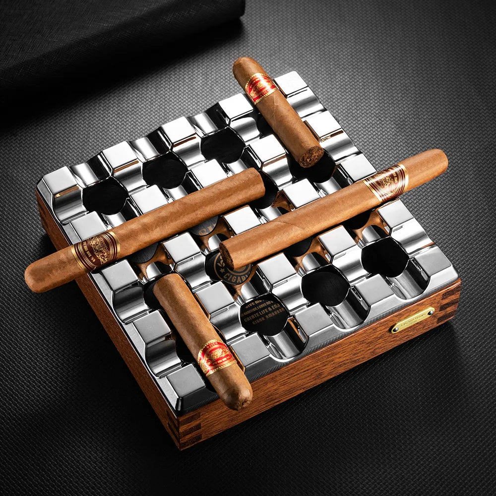 Cigar humidor with wooden and metal design on a dark surface