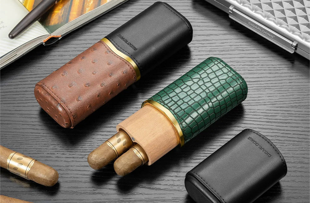 Two portable cigar cases with cigars on a dark surface, featuring the brand 'Garlong'.
