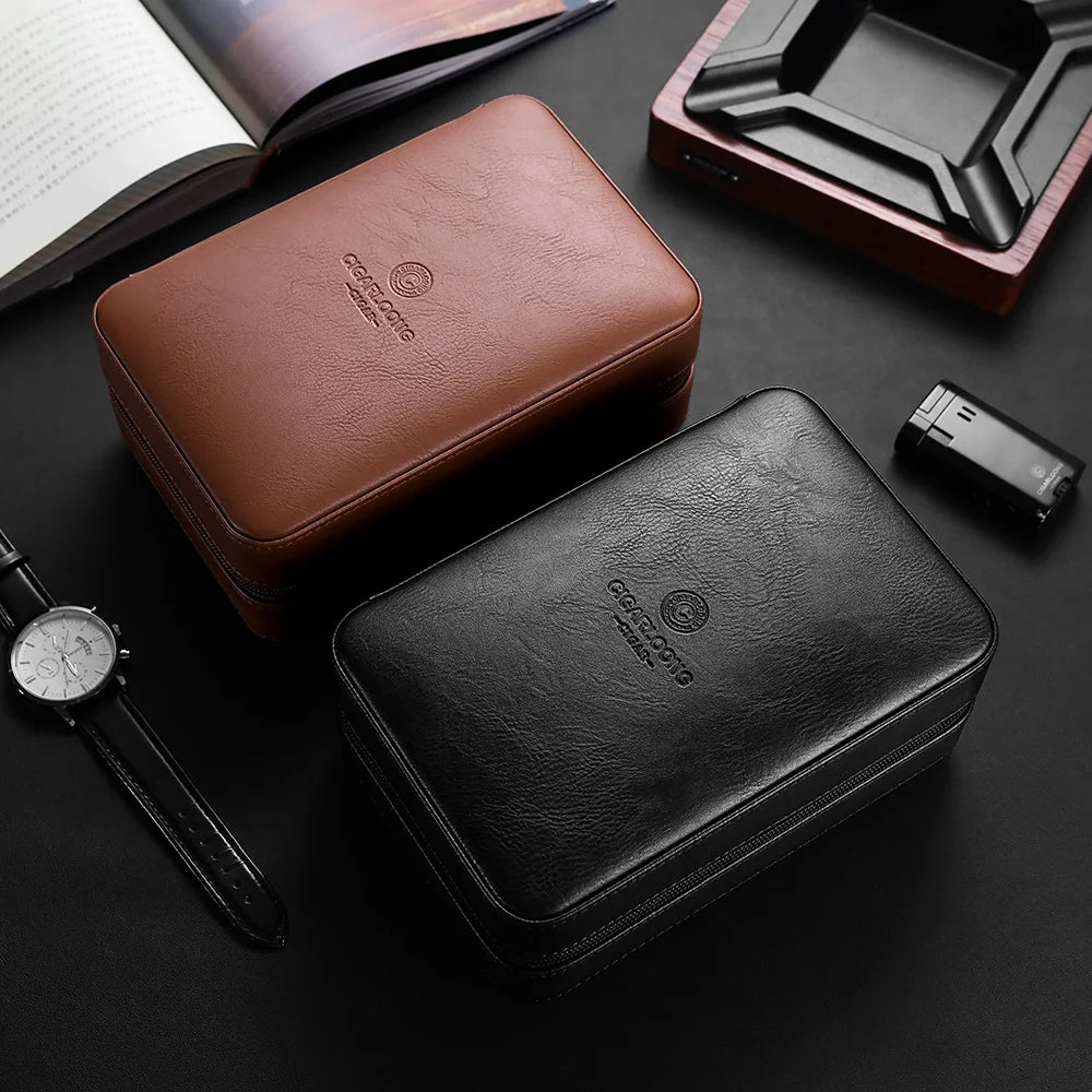 Brown and black leather cases on a dark surface with a watch and book in the background.