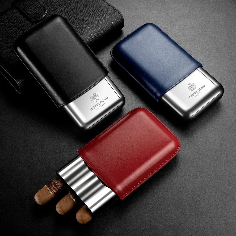 Three cigar humidors in black, blue, and red on a dark surface.