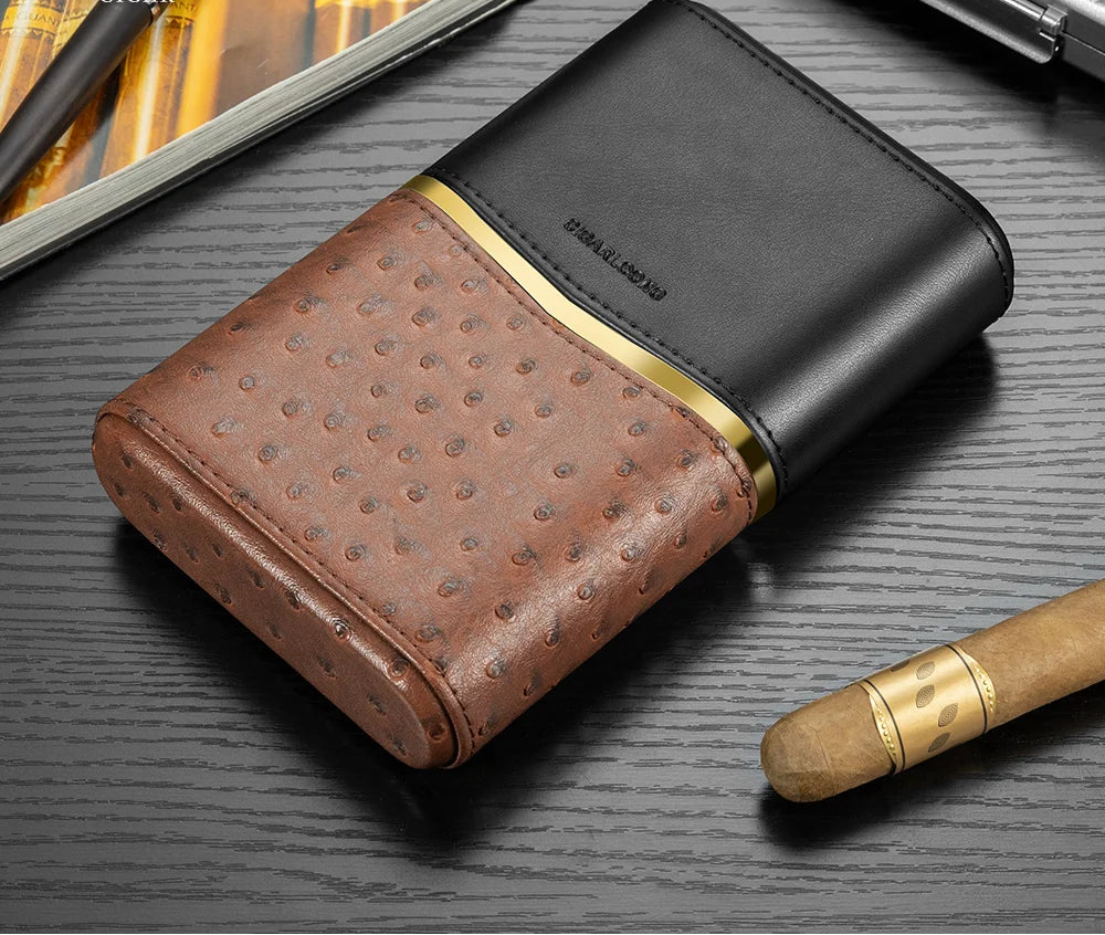 Brown and black leather cigar case with gold accents on a dark surface, featuring Cigarloong branding.