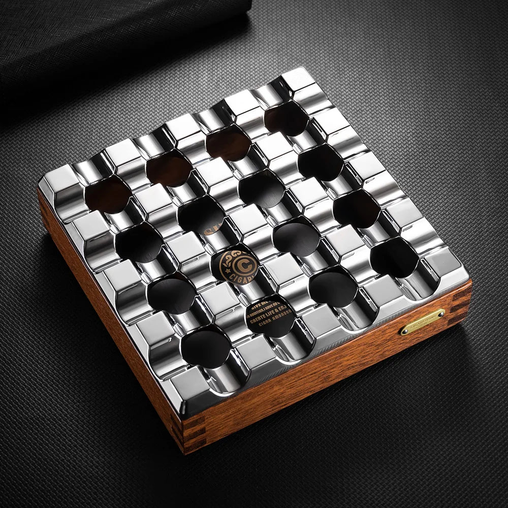 Metallic and wooden coaster set with a brand logo on a dark surface