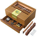 Wooden cigar humidor with accessories on a white background