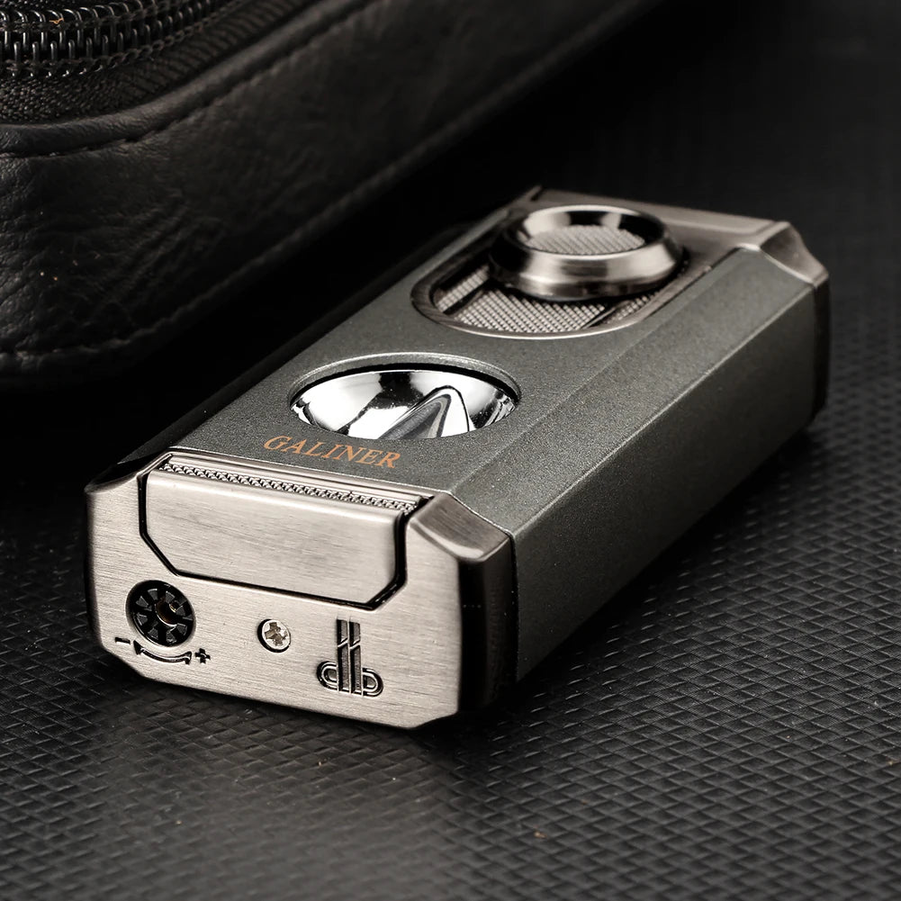 Metallic lighter on a textured black surface