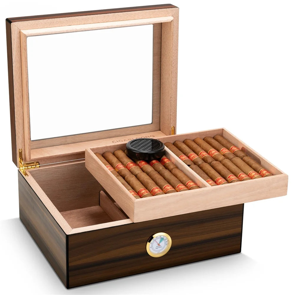 Wooden humidor with glass top containing cigars  on a white background
