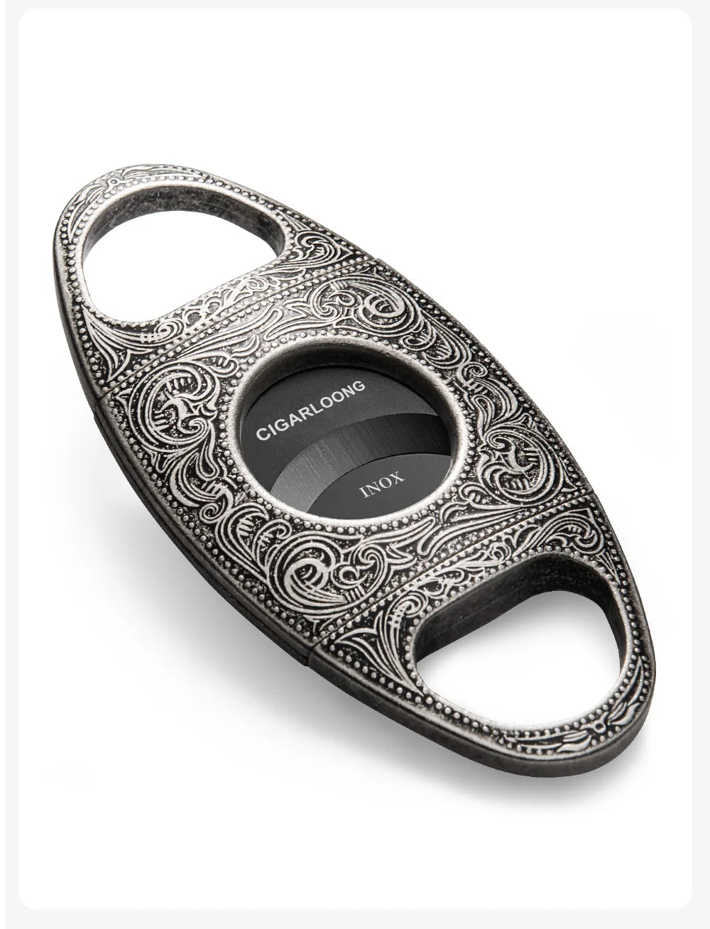 Decorative silver cigar cutter with intricate patterns and a black blade on a white background.