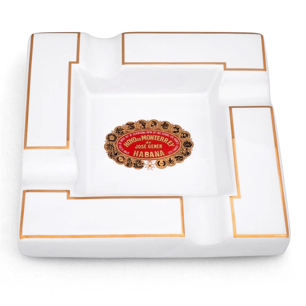 White ashtray with Hoyo de Monterrey logo on a white background